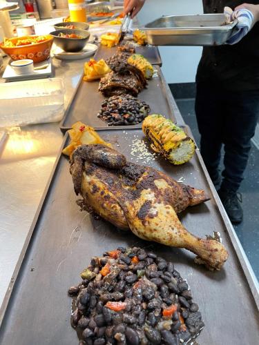 a row of different types of food on a table at TRYP Adelaide by Wyndham in Adelaide