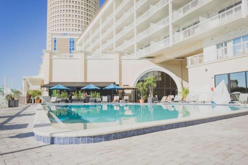 a swimming pool in front of a hotel at Hotel Tampa Riverwalk in Tampa