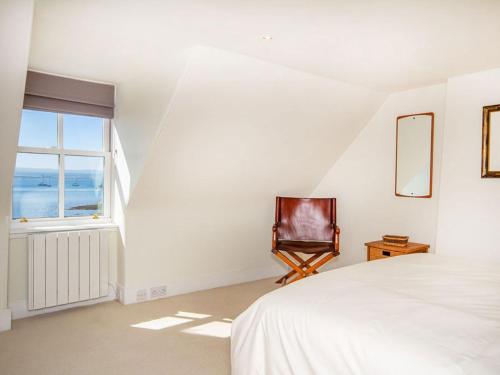 a bedroom with a bed and a window at Braefoot in Fortrose
