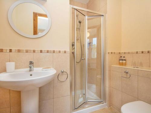 a bathroom with a sink and a shower at Birds Eye View in Dornoch