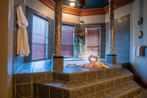 a bathroom with a tub with an octopus on the counter at The Anniversary Inn - Boise in Boise