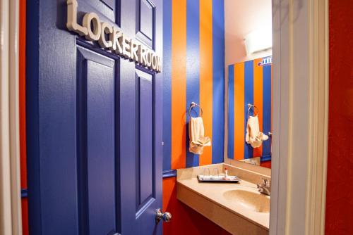 a bathroom with a blue door and a sink at The Anniversary Inn - Boise in Boise
