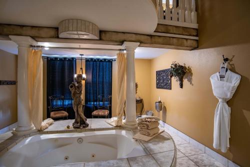 a large bathroom with a large tub in a room at The Anniversary Inn - Boise in Boise
