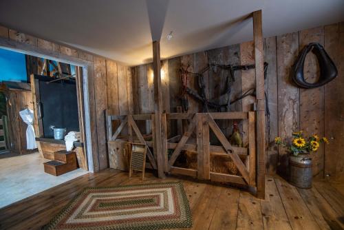 a room with a wooden wall with a wooden door at The Anniversary Inn - Boise in Boise