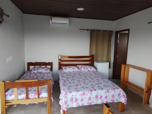 Postel nebo postele na pokoji v ubytování Chalé Beach Macapá