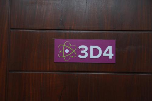 a sign on a wooden door with the number at Mzion Hotel Weligama in Weligama