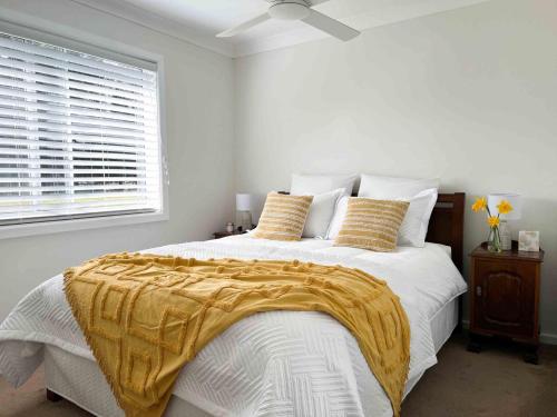 Postel nebo postele na pokoji v ubytování Creek View Cottage, Fitzroy Falls