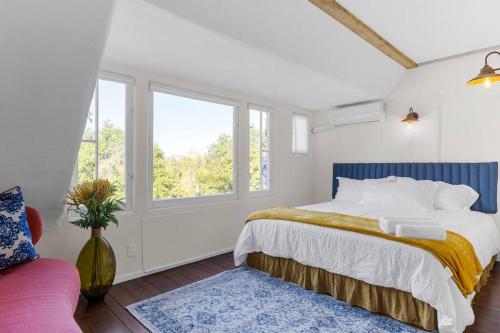 a white bedroom with a bed and a window at The Magic Castle Unit 1 -Six Flags Universal LAX in Santa Clarita