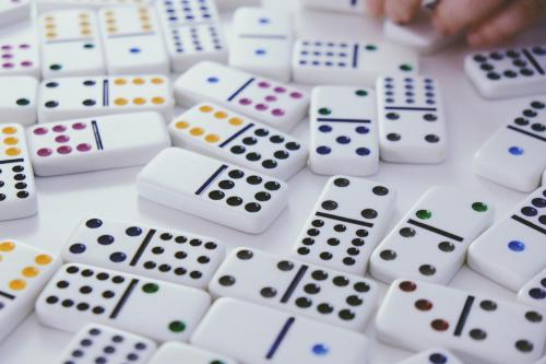 a person playing a game of dominoes at Ocean Sands Beach Boutique Inn-1 Acre Private Beach-St Augustine Historic-2 Miles-Shuttle with Downtown Tour-HEATED Salt Water Pool until 420AM-Popcorn-Cookies-New 4k USD Black Beds- 69 Item Breakfast-Eggs-Bacon-Starbucks- Free Laundry- #904-799-SAND in Saint Augustine