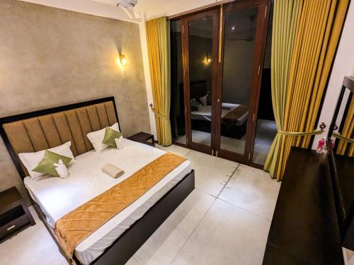 a bedroom with a bed in a room with a window at The Aurelia in Gampola