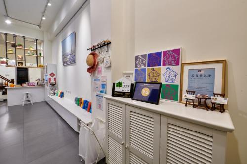 a store with a counter in the middle of a room at JiJi 16 in Jiji