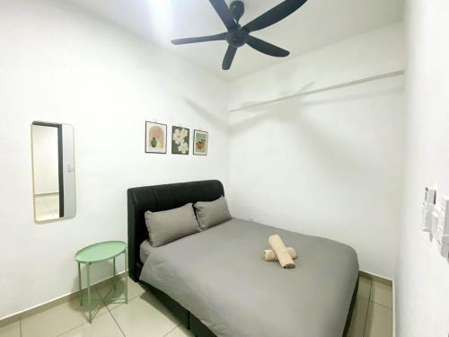 a teddy bear sitting on a bed in a room at JOVIAL Modern Cozy Suite `Metropol BM BandarPerda in Bukit Mertajam
