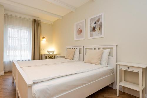 Katil atau katil-katil dalam bilik di Vaivutės apartamentai No4