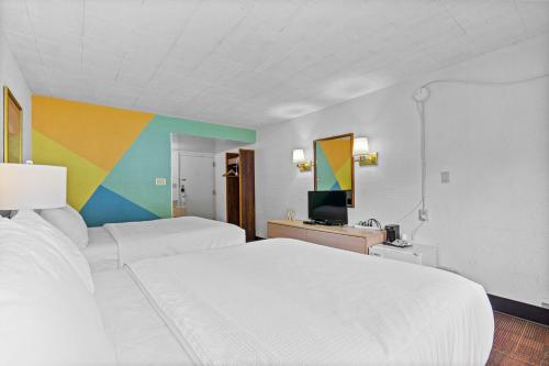 Ένα ή περισσότερα κρεβάτια σε δωμάτιο στο Stardust Motel Wallace