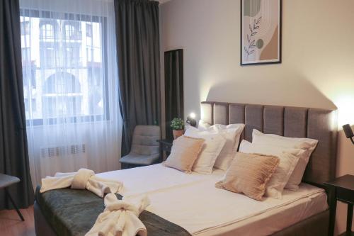 Voodi või voodid majutusasutuse Antonovi Apartments Deluxe toas