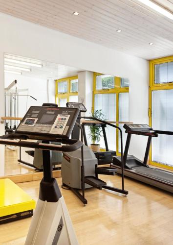 a gym with a treadmill and a treadmill at Best Western Premier Grand Hotel Russischer Hof in Weimar