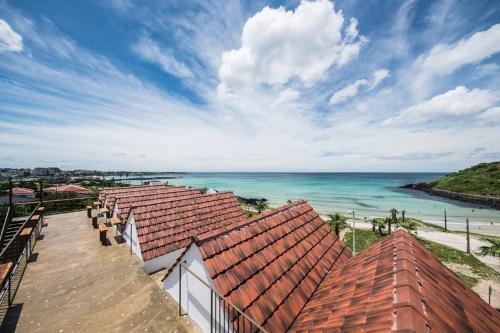 a view of the ocean from the roof of a building at Yaho Beach House in Jeju