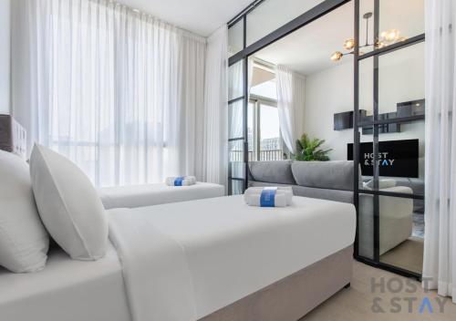 Postel nebo postele na pokoji v ubytování Modern 2BR at Collective, Dubai Hills