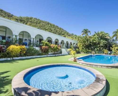 a pool at a resort with two swimming pools at AFFORDABLE ISLAND ESCAPE! Queen Studio, Nelly Bay in Nelly Bay