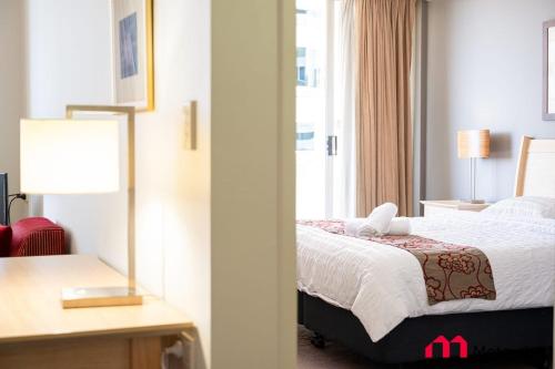 a hotel room with a bed and a window at MetaWise Chatswood 1Bed next to station in Sydney