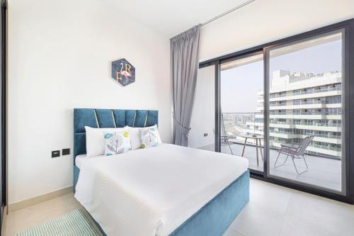 a bedroom with a bed and a large window at Homesgetaway - Ultraluxury 1BR in Binghatti Creek - Al Jaddaf in Dubai