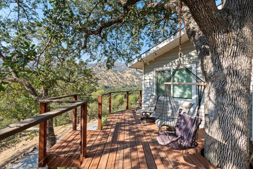 a porch swing hanging from a tree at Views, Hot Tub, Outdoor Shower, 15m from Sequoia in Three Rivers