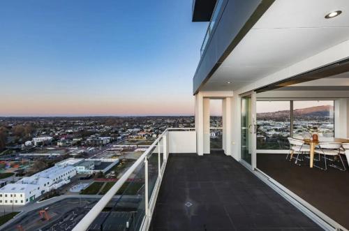 a balcony with a view of a city at Sub-Penthouse on Gloucester - Highest rental in the South Island in Christchurch