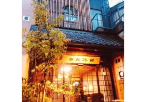 a store front of a building with a balcony at Nara Ryokan - Vacation STAY 49528v in Nara