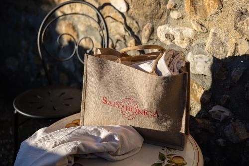 a paper bag sitting on top of a plate at Salvadonica in San Casciano in Val di Pesa