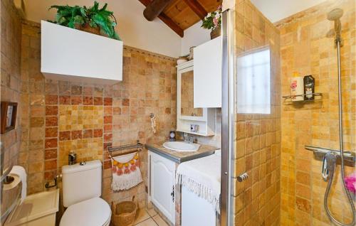 a bathroom with a toilet and a sink at Beautiful stacaravan In Raphle-les-arles With Kitchen in Raphèle