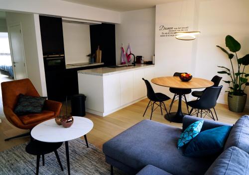 a living room with a couch and a table at Desire 2 Lux Apartment Free Parking On Premise in Ostend