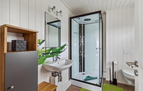 a bathroom with a sink and a glass shower at 2 Bedroom Pet Friendly Home In Zerpenschleuse in Zerpenschleuse