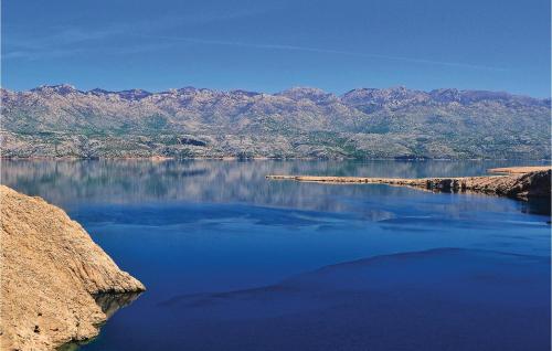 a large body of water with mountains in the background at Vila Sidro in Košljun