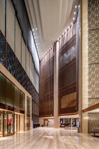 a large building with a lobby with a large ceiling at Crowne Plaza Xi'an by IHG in Xi'an