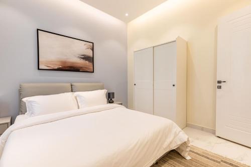 Postel nebo postele na pokoji v ubytování Amber Hospitality - Al Qairawan