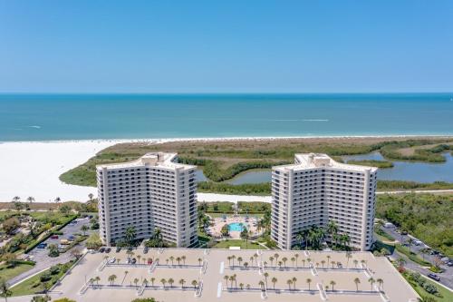 an aerial view of two condos on the beach at Updated 2 Bed Condo Offering Long Beach Views From Balcony in Marco Island