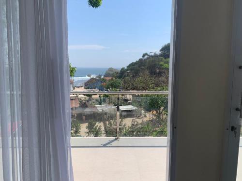 an open window with a view of the ocean at Villa Orion Sundak in Tepus