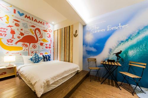 a bedroom with a surfboard on the wall at Superman in Luodong