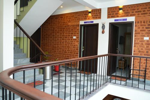 a staircase with two doors in a brick building at UNGA VEEDU PAY AND STAY in Tiruvannāmalai