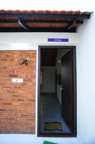 a door to a building with a sign on it at UNGA VEEDU PAY AND STAY in Tiruvannāmalai
