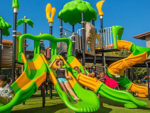 a group of children playing on a playground at Zimbali Suite 207 in Ballito