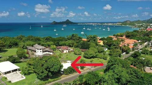 an aerial view of a house with a red arrow at The Lane Rodney Bay 1 bedroom rate - Newly renovated & tastefully furnished 3 bedroom house home in Rodney Bay Village
