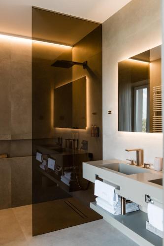a bathroom with a sink and a mirror at Boutique Hotel HOH in Zagreb