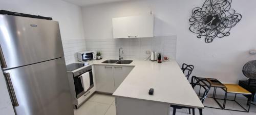 Η κουζίνα ή μικρή κουζίνα στο JTower Royal Suites - Alefimmoed