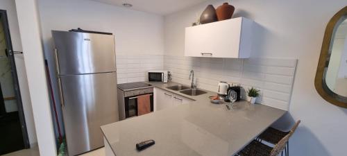 Η κουζίνα ή μικρή κουζίνα στο JTower Royal Suites - Alefimmoed