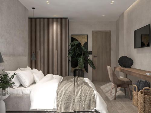 a bedroom with a white bed and a desk at Dwell House 5 in Ioannina