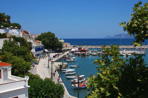 a view of a harbor with boats in the water at Aktaion Guest Rooms in Skopelos Town