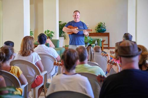 a man standing in front of a crowd of people at Aston Kaanapali Shores in Lahaina