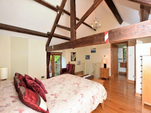 a bedroom with a large bed in a room with wooden ceilings at 1 Bed in Knighton 58997 in Whitton