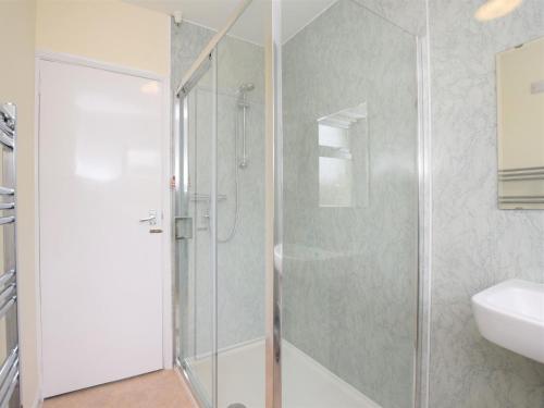 a bathroom with a shower and a sink at 2 bed in Bude 58818 in Bude